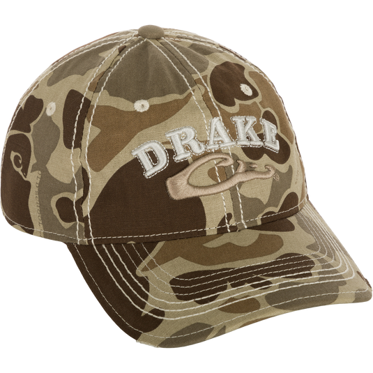 Distressed 6-Panel Ball Cap with raised Drake Logo embroidery, frayed visor, and contrast stitching. Cotton twill panels and adjustable closure.