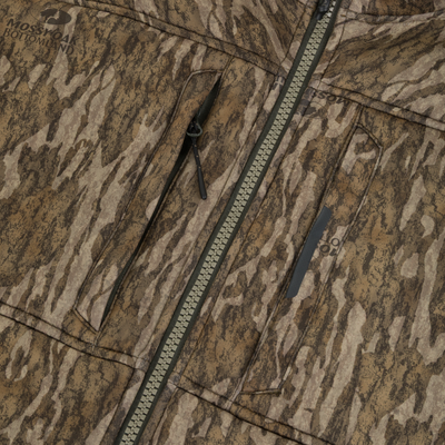 Close-up of the Non-Typical Midweight Nova Silencer Jacket with Scent Control from Nontypical in a brown and tan camo pattern, two black zippers, anti-odor tech, and Mossy Oak Bottomland logo on the fabric.