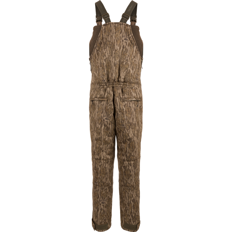 Midweight Nova Silencer Bib with Scent Control, featuring camo pattern, adjustable straps, zippered pockets, and insulated with sherpa fleece for warmth, breathability, and silence.