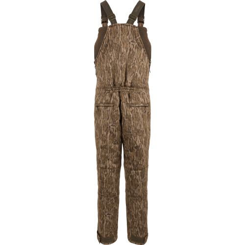 Midweight Nova Silencer Bib with Scent Control, featuring camo pattern, adjustable straps, zippered pockets, and insulated with sherpa fleece for warmth, breathability, and silence.