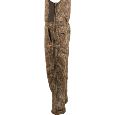Midweight Nova Silencer Bib with Scent Control, featuring adjustable straps, full-length side zippers, and multiple pockets, designed for warmth and quiet during outdoor hunting.