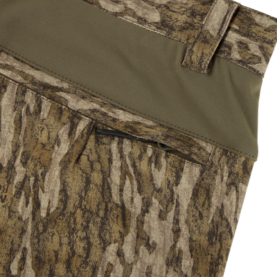 Close-up of Sale Non-Typical SWT Pant with Scent Control, featuring water-resistant camouflage fabric, green waistband, belt loop, zippered pocket, and stretch material for comfort and mobility outdoors.