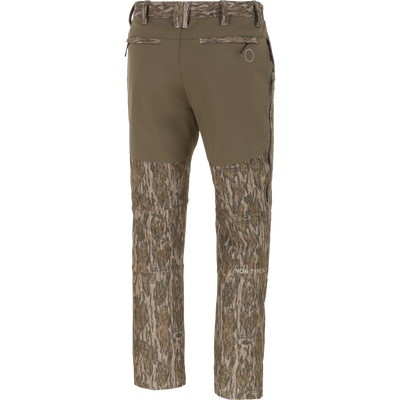 Back view of olive green Non-Typical Pursuit Softshell Pant with Agion Active X2 hunting pants, featuring a camouflage pattern on the lower legs and waistband.