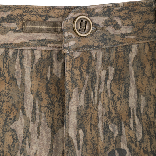 Close-up of the waistband and button closure of Non-Typical Pursuit Softshell Pant with Agion Active X2 camouflage-patterned hunting pants.