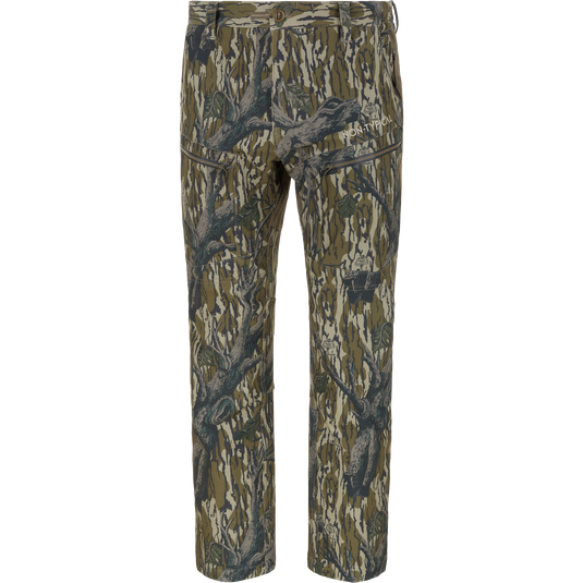 Non-Typical Pursuit Softshell Pant with Agion Active X2 in Mossy Oak Original Treestand, featuring a full-length camouflage design and zippered thigh pockets.