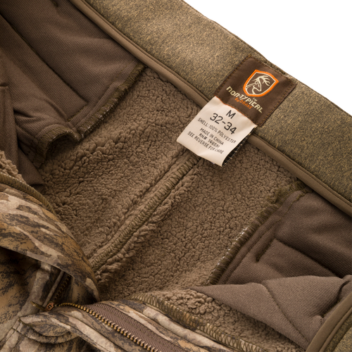 Close-up of the Silencer Soft Shell Pant with Agion Active XL, highlighting the adjustable waist and label detailing scent control technology.
