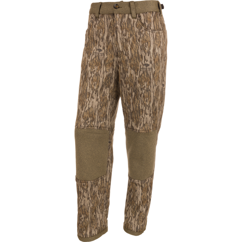 Silencer Soft Shell Pant with Agion Active XL, featuring a camouflage pattern, front and rear pockets, adjustable waist and ankles, and elastic foot stirrups for hunting.