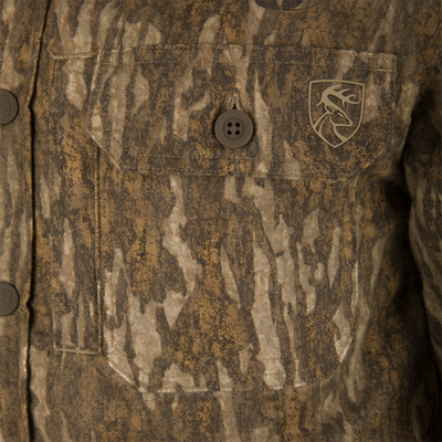 Close-up of the Non-Typical Campfire Hoodie's pocket, featuring a deer-head emblem and buttoned flap, reflecting its functionality and outdoor hunting apparel style.