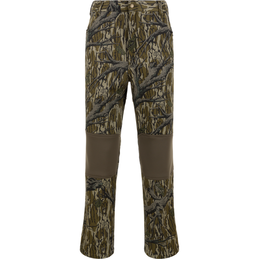 Non-Typical Endurance Pant with Scent Control by Nontypical in Mossy Oak Original Treestand; fleece-lined, reinforced brown knee patches, tree branch and leaf pattern, and front button closure, shown on white background.