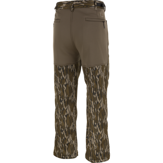 Back view of Nontypical Youth Endurance Pant in khaki with camo lower half, belt loops, back pockets, and a button closure on one pocket.
