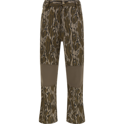 Nontypical Youth Endurance Pant in Mossy Oak Original Bottomland features reinforced knee patches, front button, zipper, belt loops, and is made from a microfiber stretch fabric. Displayed against a white background.