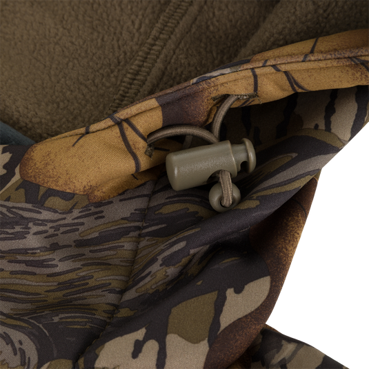 Close-up of a Non-Typical Endurance Hooded Full Zip Jacket with Scent Control, featuring a camouflage pattern and an adjustable drawstring cord lock at the neck.