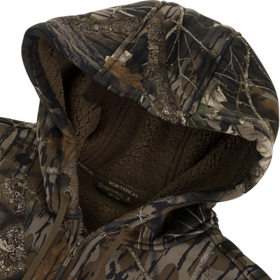 A close-up of the Nontypical Non-Typical Slacker Quarter Zip Hoodie shows a camouflage hood, soft polyester microfiber, drawstrings, and detailed stitching in brown, green, and tan.