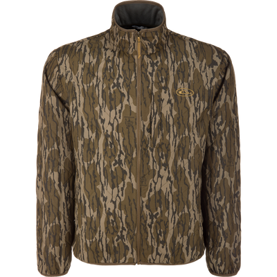 The Lifestyle Delta Quilted Jacket in Mossy Oak Original Bottomland features water resistance, a zip-up front, high collar, and an embroidered logo on the left chest, shown against a plain white background.