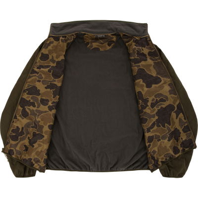 The Lifestyle Delta Quilted Jacket in green is shown laid flat, unzipped to display a brown and green camo lining, elastic cuffs, and a plain dark quilted back interior.