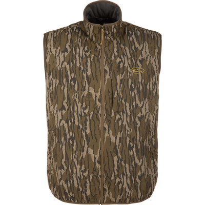 Delta Quilted Vest in a Mossy Oak Original Bottomland camouflage pattern, featuring a water-resistant quilted design, a full-length front zipper, and a zippered chest pocket.