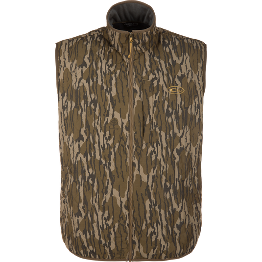 Delta Quilted Vest in a Mossy Oak Original Bottomland camouflage pattern, featuring a water-resistant quilted design, a full-length front zipper, and a zippered chest pocket.