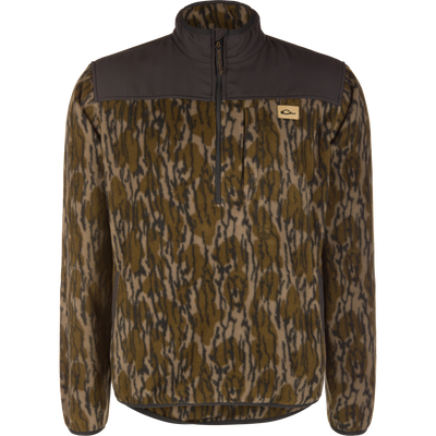Camp Fleece Over Under Quarter Zip in Mossy Oak Original Bottomland camouflage, featuring a durable outdoor design with solid dark brown panels on the shoulders and collar.