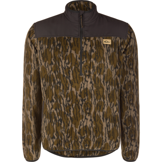 Camp Fleece Over Under Quarter Zip in Mossy Oak Original Bottomland camouflage, featuring a durable outdoor design with solid dark brown panels on the shoulders and collar.
