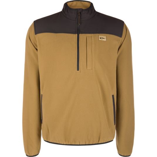 Lifestyle Camp Fleece Over Under Quarter Zip in field khaki featuring a dark brown collar, shoulder yoke, and a durable outdoor vertical zippered chest pocket.