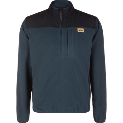 Midnight Navy Camp Fleece Over Under Quarter Zip featuring a black upper chest panel, a vertical zippered chest pocket, and a small rectangular logo patch.