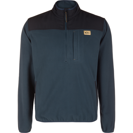 Midnight Navy Camp Fleece Over Under Quarter Zip featuring a black upper chest panel, a vertical zippered chest pocket, and a small rectangular logo patch.