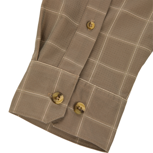 Tan long-sleeved Wingshooter Hunter Creek shirt cuff with a white grid pattern and three brown marbled buttons.