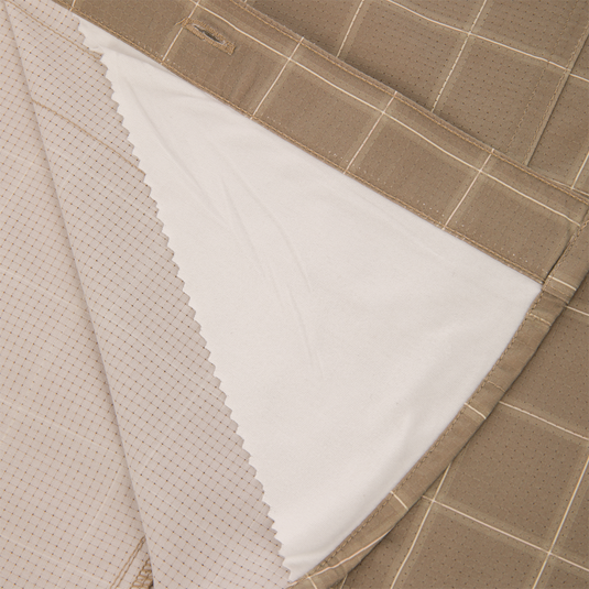 Close-up of a tan plaid Wingshooter Hunter Creek shirt, showing the underside of the collar and a folded-back section that reveals a contrasting light-colored fabric lining.