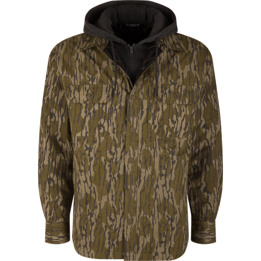 The Campfire Flannel Hoodie in Mossy Oak Original Bottomland features a camo-print button-down shirt with a dark gray hooded inner layer.