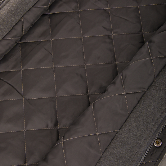 Close-up of the dark grey quilted lining inside a Campfire Flannel Hoodie.