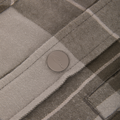 Close-up of a gray plaid Campfire Flannel Hoodie featuring a matte gray button embossed with a duck silhouette.