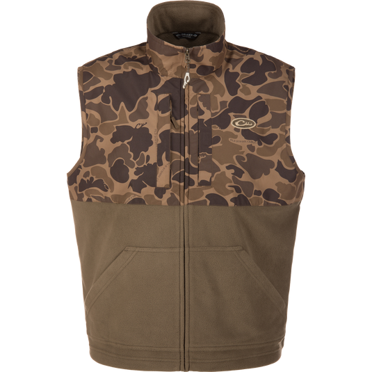 The Lifestyle Eqwader Vest in Old School Sport features a sleeveless design, camouflage upper, solid olive fleece lower, front zipper, and two pockets—a breathable hunting vest for outdoor use.