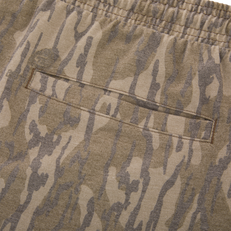 Close-up of the Tri-Blend Campus Short with camo-print, featuring an elastic waistband and welt pocket, highlighting its soft, stretchy, and quick-drying fabric.