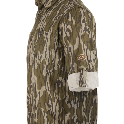 Youth Long-Sleeved Flyweight Shirt in camo pattern, featuring chest pocket, roll-up sleeve tab, and brand patch, designed for moisture-wicking and sun protection.