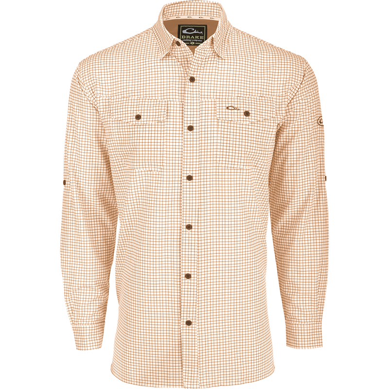 A lightweight, Four Way Stretch long sleeve shirt with a checkered pattern. Perfect for the man on the go, whether on vacation or running errands. Features include hidden button-down collar, adjustable roll-up sleeves, and two chest pockets. From Drake Waterfowl.