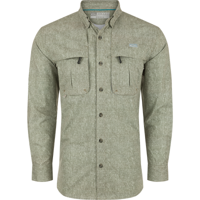 A Drake Heritage Heather Shirt L/S, a long-sleeved shirt with pockets. Made of 100% polyester micro mesh for natural cooling, moisture-wicking, and quick-drying. Features include a hidden button-down collar, vented cape back, and two front chest pockets. Perfect for performance on the water or at the office.