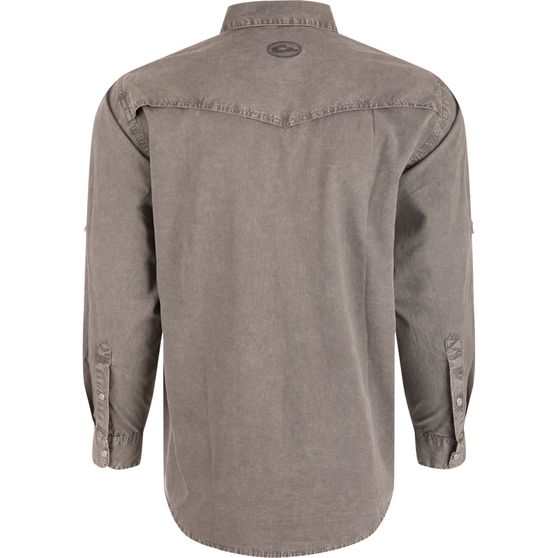 Rear view of Cinco Ranch Western Solid Acid Wash Long Sleeve Shirt, showcasing its vented western back cape, faux pearl snaps, and adjustable roll-up sleeves.