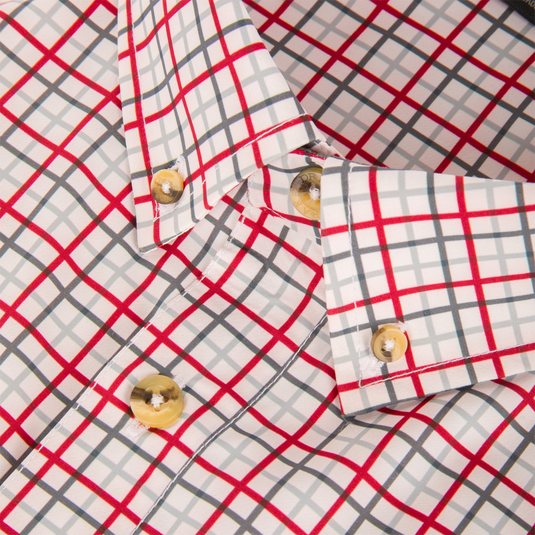 Close-up of a Lifestyle Frat Tattersall Button-Down Long Sleeve Shirt featuring a red, grey, and white check pattern with light brown buttons.
