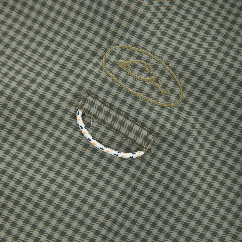 Close-up of houndstooth fabric with oval logo and cord detail, showcasing the Frat Gingham Check Button-Down Long Sleeve Shirt's technical features and casual style.