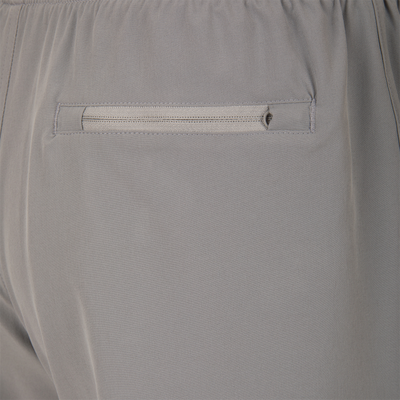 Drake Commando Lined Volley Short 7 with built-in liner, adjustable waistband, and moisture-wicking fabric, featuring front and back pockets with zippers.