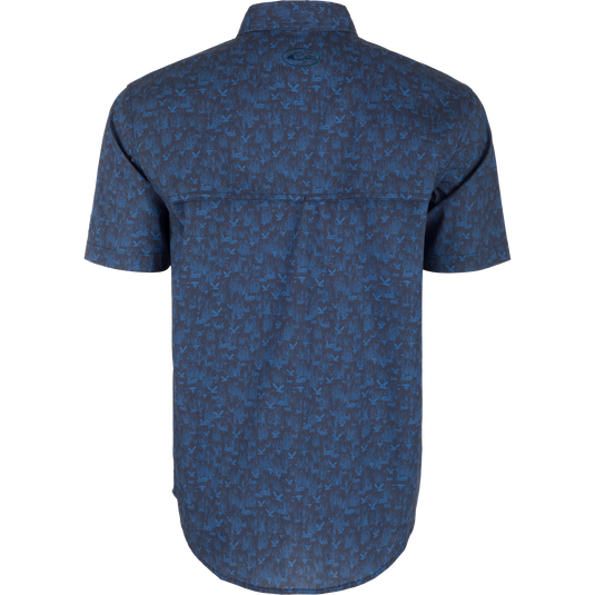 Cotton Marsh Print Short Sleeve Shirt with bird and plant pattern, featuring button-down collar, flap pockets, and sculpted hem, ideal for versatile, active wear.