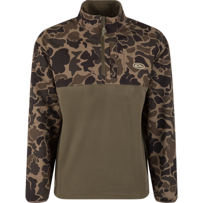 The MST Quarter Zip Refuge Eqwader Jacket by Waterfowl features a camo-patterned top, solid olive green lower half, quarter-zip front, and left chest logo—ideal for pairing with breathable wader gear for waterfowl hunting.