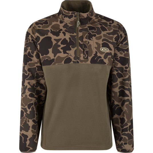 The MST Quarter Zip Refuge Eqwader Jacket by Waterfowl features a camo-patterned top, solid olive green lower half, quarter-zip front, and left chest logo—ideal for pairing with breathable wader gear for waterfowl hunting.