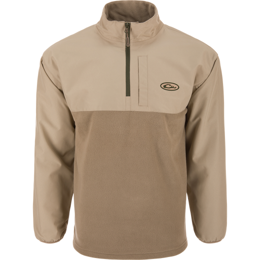 The Waterfowl MST Quarter Zip Refuge Eqwader Jacket features a tan and brown design, quarter-zip front, long sleeves, stand-up collar, and small logo—ideal with breathable waders for waterfowl hunting adventures.