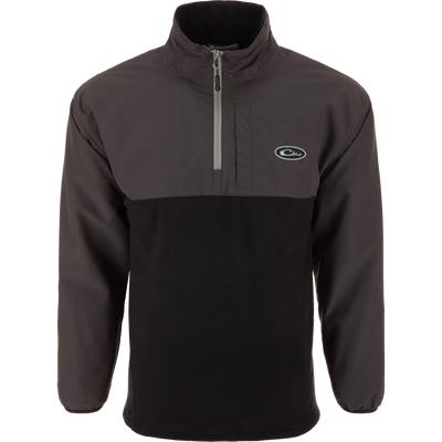 The MST Quarter Zip Refuge Eqwader Jacket by Waterfowl is a black and dark gray pullover with a half-zip front, high collar, long sleeves, left chest logo, and casual design inspired by wader gear.