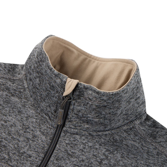 Close-up of the Fall Brake Sweater Fleece Half Zip by Sale—a gray polyester jacket with a high collar, light brown lining, textured fabric, zip chest pocket, and partially zipped branded pull.