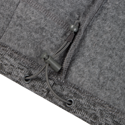 Close-up of the Fall Brake Sweater Fleece Vest by Sale, showing its gray fleece fabric, adjustable drawstring with plastic toggles, and detailed stitching along the seam and hem.