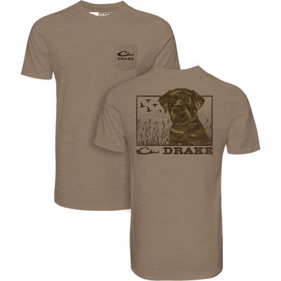 The Lifestyle Chocolate Lab T-Shirt in Savanna Tan features a small Drake logo on the front pocket and a camo dog with flying ducks and Drake text on the back.