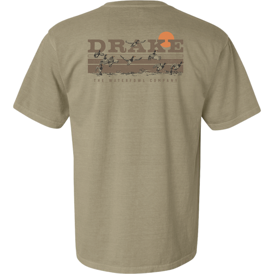 Back of the Take Flight T-Shirt featuring the Drake Waterfowl logo, orange sun, and ducks in flight across a marsh, highlighting outdoor hunting themes.