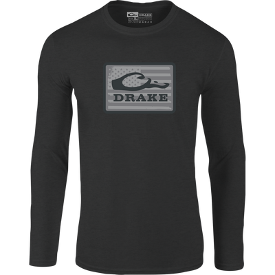 The Graphic Work Long Sleeve T-Shirt by Sale comes in charcoal and features a gray rectangular abstract logo patch with a subtle American flag background, crafted from soft cotton-polyester material.